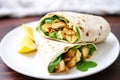 chicken shawarma wrap cut in half, showing the filling Royalty Free Stock Photo