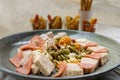 Chicken and Shrimp Fusilli with Cheese, Sausage and Bread in Ceramic plate on white background