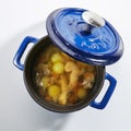 Chicken Soup in a Blue Pan Isolated Top View Royalty Free Stock Photo