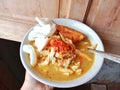 Chicken soup in a bowl. Soto ayam is a typical Indonesian food in the form of a type of chicken soup with a yellowish sauce.