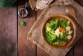 Chicken soup with broccoli, green peas, carrots and celery Royalty Free Stock Photo