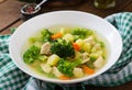 Chicken soup with broccoli, green peas, carrots and celery Royalty Free Stock Photo