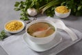 Chicken soup , chicken broth, with pieces of chicken and vegetables and shkedei marak an Israeli food product Royalty Free Stock Photo