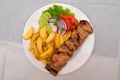 Chicken souvlaki with French fries, Balkan plate