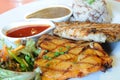 Chicken spicy and pock grilled with sauces and brown rice.