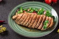 Chicken steak roasted and salad, food photography. Black background. Top view Royalty Free Stock Photo