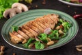 Chicken steak roasted and salad, food photography. Black background. Top view Royalty Free Stock Photo