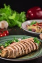 Chicken steak roasted and salad, food photography. Black background. Top view Royalty Free Stock Photo