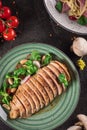 Chicken steak roasted and salad, food photography. Black background. Top view Royalty Free Stock Photo