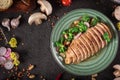 Chicken steak roasted and salad, food photography. Black background. Top view Royalty Free Stock Photo