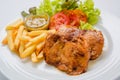 Chicken steak served with french fries and salads to vegetables Royalty Free Stock Photo
