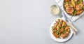 Chicken stew with potatoes, mushrooms and green peas, on a white plate and in metal pot, top view, horizontal, copy space Royalty Free Stock Photo