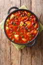 Chicken stew with red beans in hot chili sauce close-up in a pan. verticall top view Royalty Free Stock Photo