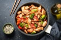 Chicken stir fry with vegetables and sesame.