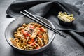 Chicken Stir-fry. Wok udon noodles. Traditional asian food. Black background. Top view