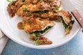 Chicken stuffed with spinach with dried tomato sauce