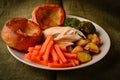 Chicken Sunday dinner with Yorkshire puddings Royalty Free Stock Photo