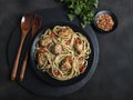 Chicken teriyaki with asian noodles udon , sesame, rustic stone background. Closeup. Chinese/Japanese noodles