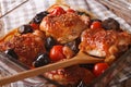 Chicken thigh baked with tomatoes and porcini mushrooms close up Royalty Free Stock Photo