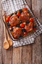 Chicken thigh baked with tomatoes and porcini mushrooms close up Royalty Free Stock Photo