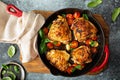 Chicken thighs roasted with tomatoes and garlic Royalty Free Stock Photo