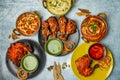 Chicken Tikka Butter Masala, Reshmi masala, Ginger Chicken, Tangri Kabab, Lal Badsha, tandoori, Peri peri, with chili sauce served Royalty Free Stock Photo