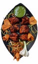 Chicken Tikka Indian Street Food. Indian or Asian recipe food served hot in black plate Royalty Free Stock Photo