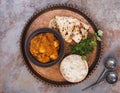 Chicken tikka masala with pulao rice and naan bread