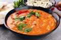 Chicken tikka masala spicy curry meat food in pot with rice and naan bread. indian food