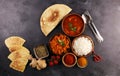 Chicken tikka masala spicy curry meat food in pot with rice and naan bread. indian food on table Royalty Free Stock Photo