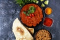 Chicken tikka masala spicy curry meat food in pot with rice and naan bread. indian food on table Royalty Free Stock Photo