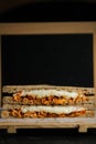 Chicken Tikka Mint Grilled Sandwich isolated on wooden board side view of fast food on dark background Royalty Free Stock Photo