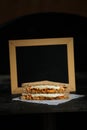 Chicken Tikka Mint Grilled Sandwich isolated on wooden board side view of fast food on dark background Royalty Free Stock Photo