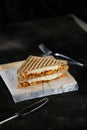 Chicken Tikka Mint Grilled Sandwich isolated on wooden board side view of fast food on dark background Royalty Free Stock Photo