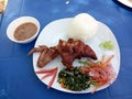 Chicken with ugali and greens with salad and beans the pepper. Royalty Free Stock Photo