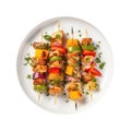 Chicken And Vegetable Kebabs On White Plate On A White Background