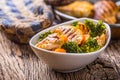 Chicken and vegetable salad. Pieces of grilled chicken with carrots and broccoli