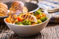 Chicken and vegetable salad. Pieces of grilled chicken with carrots and broccoli