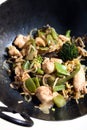 Chicken vegetable stir-fry in a wok Royalty Free Stock Photo