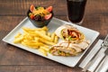 Chicken veggie wrap with french fries and salad