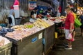 Chicken vendor preparing chicken in morning at the wet market