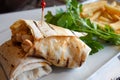 chicken warp and fresh salad on table