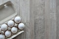Chicken white eggs in carton box on wooden table. Royalty Free Stock Photo