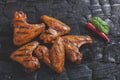 Chicken wing grilled fried black background of charcoal. Barbecue grill Royalty Free Stock Photo