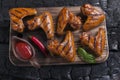 Chicken wing grilled fried black background of charcoal. Barbecue grill Royalty Free Stock Photo