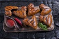 Chicken wing grilled fried black background of charcoal. Barbecue grill Royalty Free Stock Photo