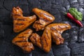 Chicken wing grilled fried black background of charcoal. Barbecue grill Royalty Free Stock Photo