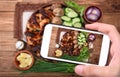 Chicken wings with baked potatoes and wine glass. Royalty Free Stock Photo