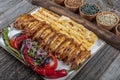 Chicken wings on barbecue grill,cooked on skewers. Deep Roasted Hot, Spicy Buffalo Style Chicken Wings on a Skewer. Appetizer Royalty Free Stock Photo