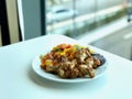 Chicken Wings with Barbecue Sauce and Vegetables Ready to Serve with Plate at Restaurant. Royalty Free Stock Photo